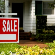For sale sign outside a family house